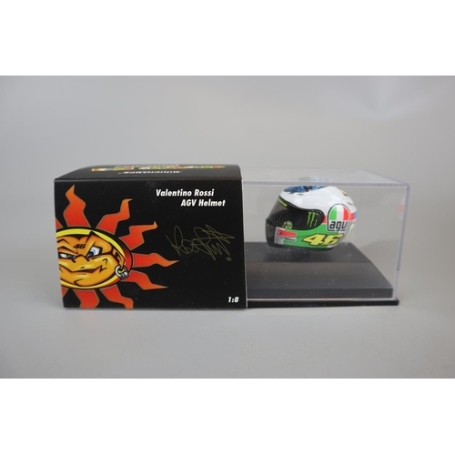 155 - Collection of 13 Minichamps 1:8 scale model AVG Valentino Rossi helmets