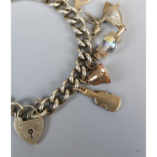 31 - Gold plated charm bracelet with gold charms