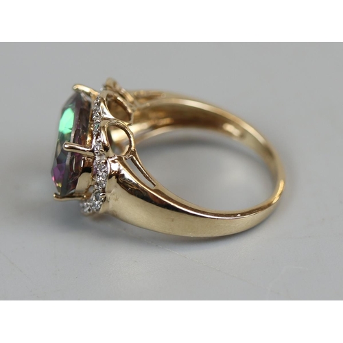 35 - Gold mystic topaz & diamond set ring (size N½)