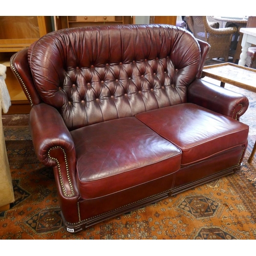 429 - Red leather 2 seater button back sofa