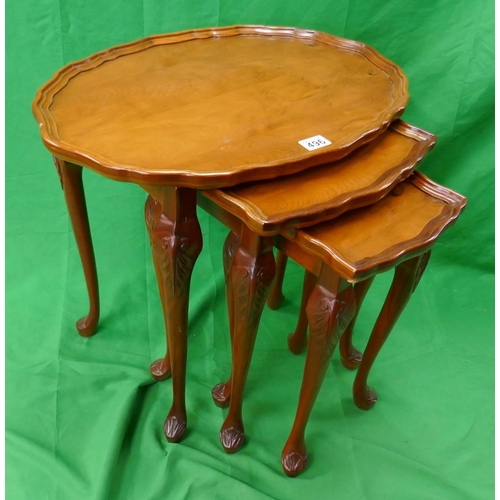 496 - Nest of 3 Yew wood tables with pie crust edge