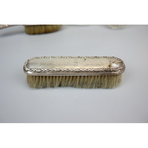 6 - Collection of hallmarked silver dressing table brushes, bottles etc