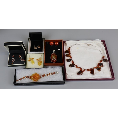 65 - Collection of amber set jewellery to include silver