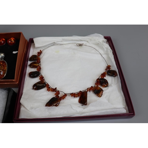 65 - Collection of amber set jewellery to include silver