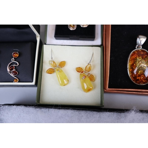 65 - Collection of amber set jewellery to include silver