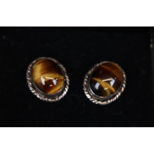 66 - 7 silver dress rings, pair of tigers eye earrings & blue stone earrings