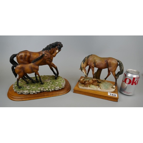 168 - 2 ceramic horse figures on wooden bases