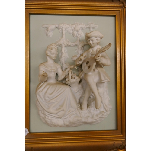 234 - Pair of bisque plaques in gilt frames