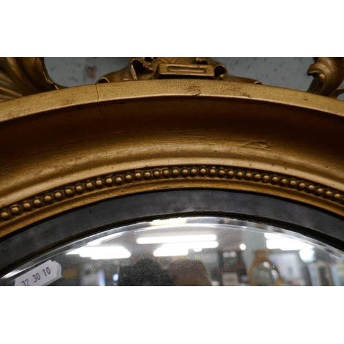 239 - Round gilt framed mirror adorned with eagle