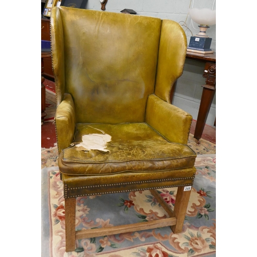 245 - Green leather wing back armchair