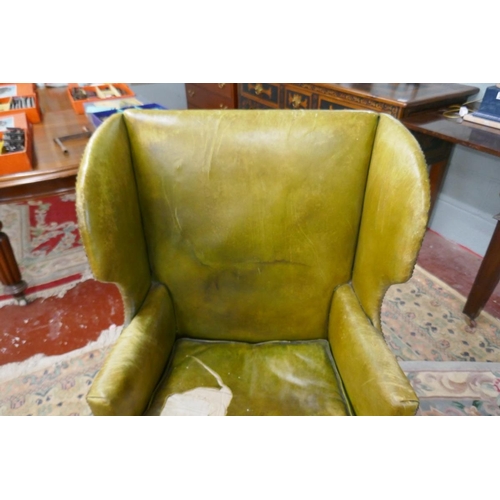 245 - Green leather wing back armchair