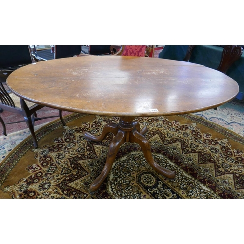 298 - Oak oval pedestal dining table