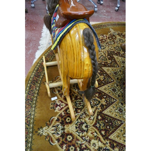 302 - Carved hardwood rocking horse