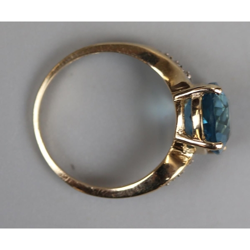 31 - Gold blue topaz & diamond ring - Size M½