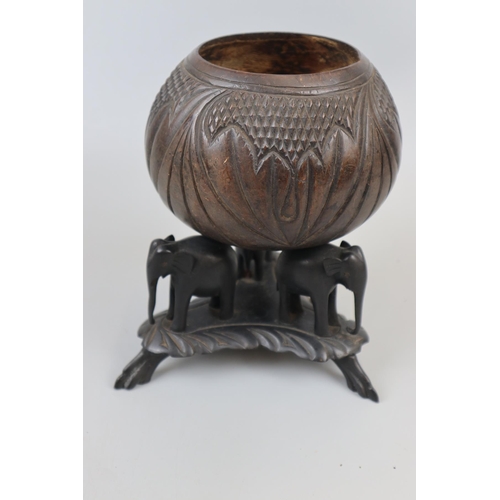 87 - Carved nut on elephant themed stand - Approx. H: 37cm