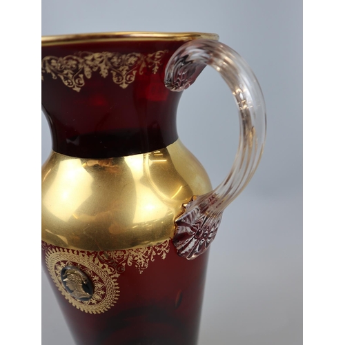 94 - Cranberry glass & gilt lemonade set