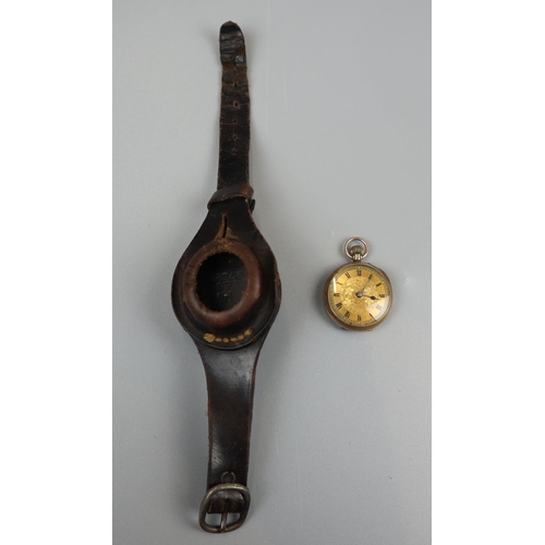 74 - Gold pocket watch in wrist strap