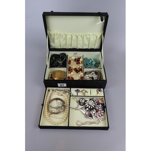 87 - Jewellery box and contents