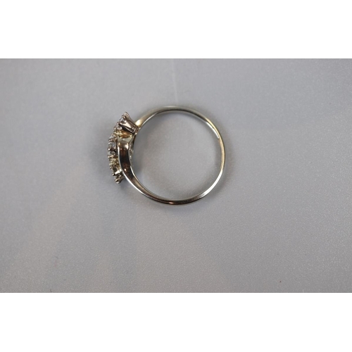 29 - Fine 18ct white gold 3 stone diamond twist ring (Size N½)