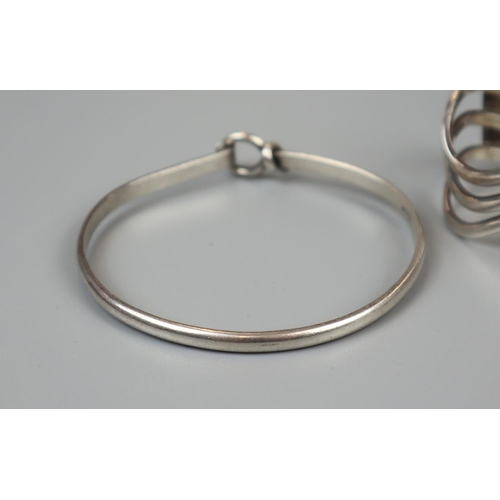 43 - 4 silver bangles