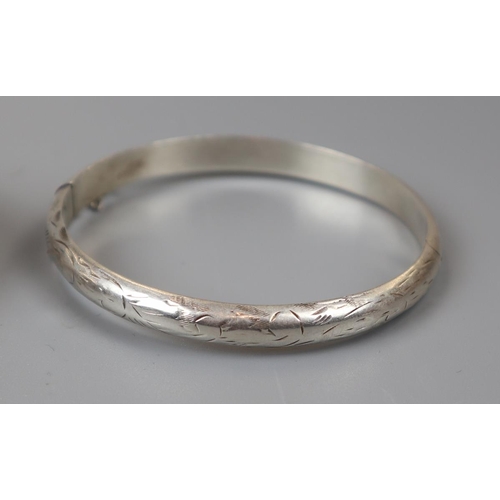 44 - 4 silver bangles