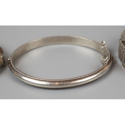 44 - 4 silver bangles