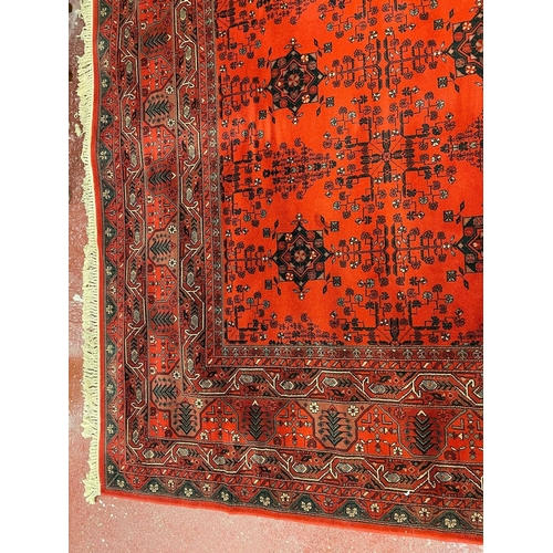 516 - Very large fine quality red patterned rug - Approx 410cm x 300cm