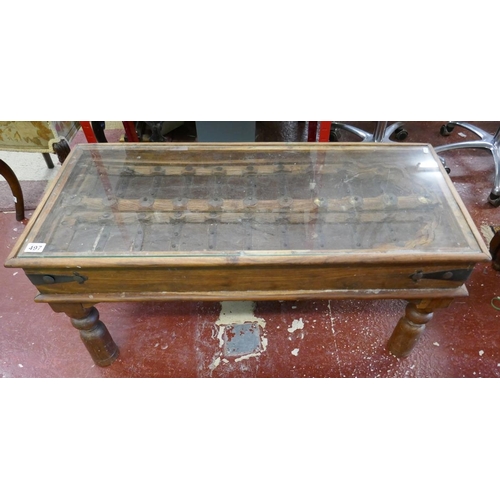 409 - Glass top coffee table made from antique Indian window shutter - Approx size: L: 102cm W: 46cm H: 49... 