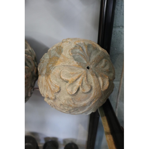 103 - 2 terracotta moulded spheres - Approx. D of biggest: 25cm