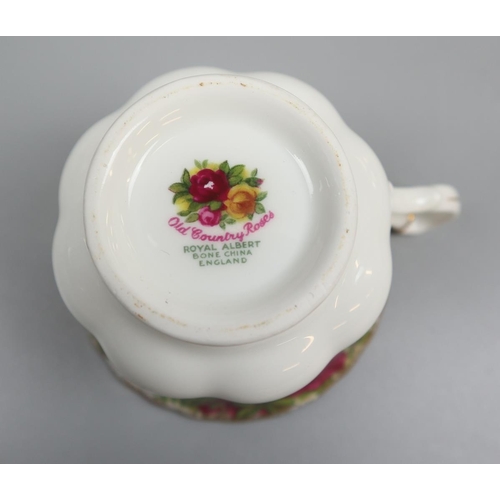 122 - Royal Albert Country Roses together with Christmas Rose tea cup and saucer