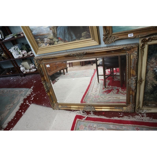 199 - Large bevelled glass mirror in ornate gilt frame - Approx. 111cm x 80cm