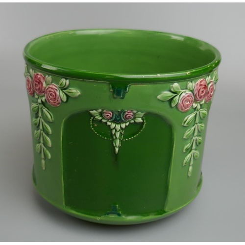 304 - Eichwald Art Nouveau pottery planter, relief moulded and painted with panels of roses onto a green g... 