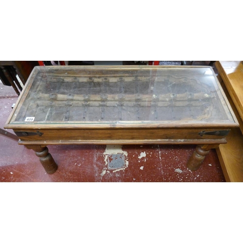 409 - Glass top coffee table made from antique Indian window shutter - Approx size: L: 102cm W: 46cm H: 49... 