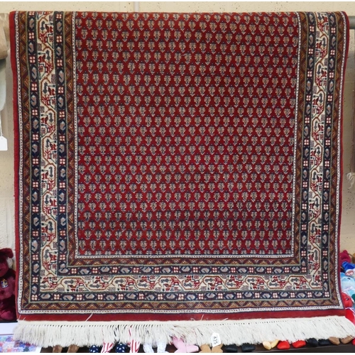 425 - Red patterned rug - Approx. 188cm x 117cm