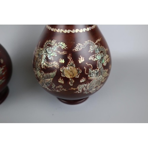 69 - Pair of rosewood vases inlaid with mother of pearl depicting dragons - Approx. H: 40cm