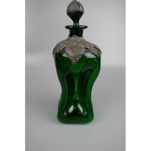 68 - Danish Holmegaard green glass decanter and another, both with pewter overlay