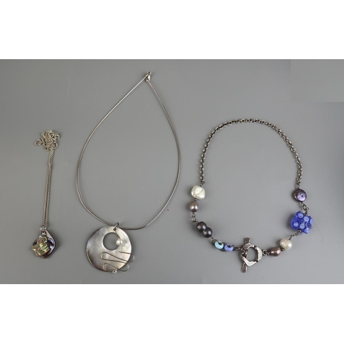 105 - 3 silver, pearl and shell necklaces