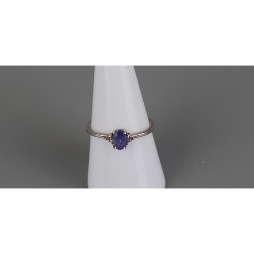 139 - Silver tanzanite and diamond ring - Size P½