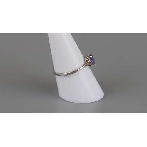 139 - Silver tanzanite and diamond ring - Size P½