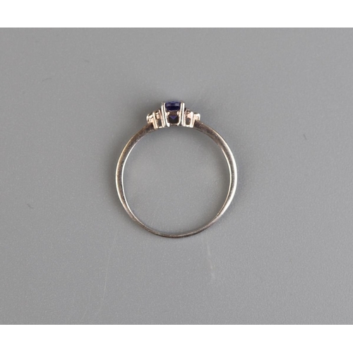 139 - Silver tanzanite and diamond ring - Size P½