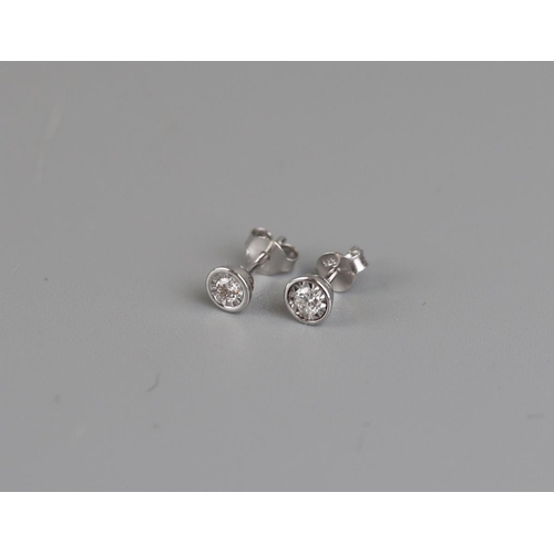 142 - White gold and diamond stud earrings