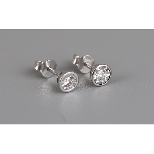 142 - White gold and diamond stud earrings