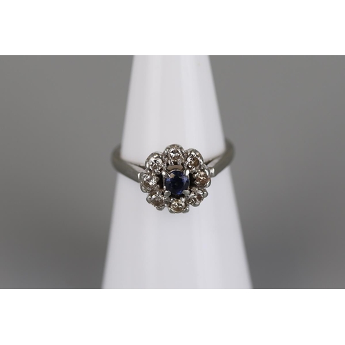 143 - 18ct white gold sapphire and diamond cluster ring - Size K