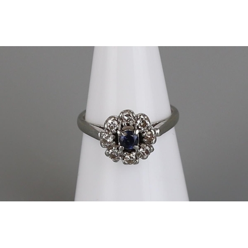 143 - 18ct white gold sapphire and diamond cluster ring - Size K