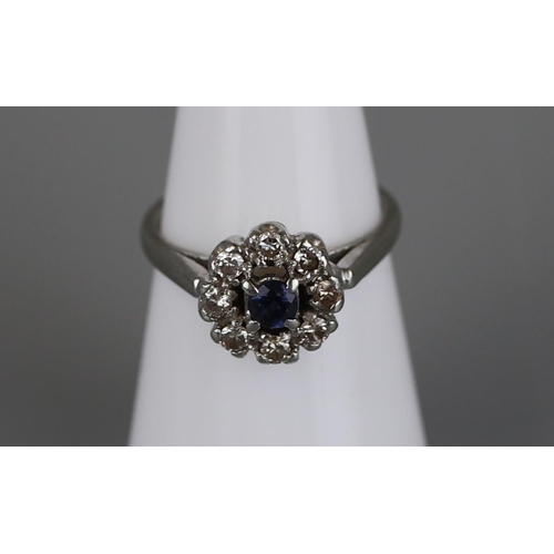 143 - 18ct white gold sapphire and diamond cluster ring - Size K