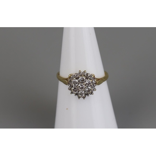 145 - 18ct gold diamond cluster ring