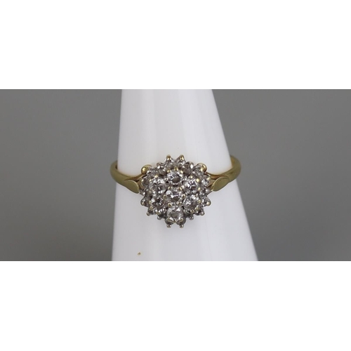 145 - 18ct gold diamond cluster ring