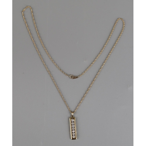 147 - Gold 7 stone diamond pendant on a gold rope chain