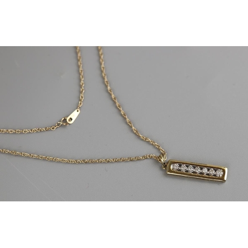 147 - Gold 7 stone diamond pendant on a gold rope chain