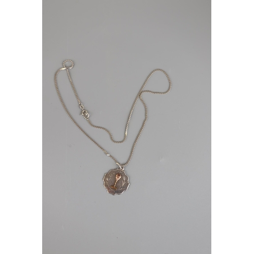 148 - Silver pendant with gold inlay on silver chain